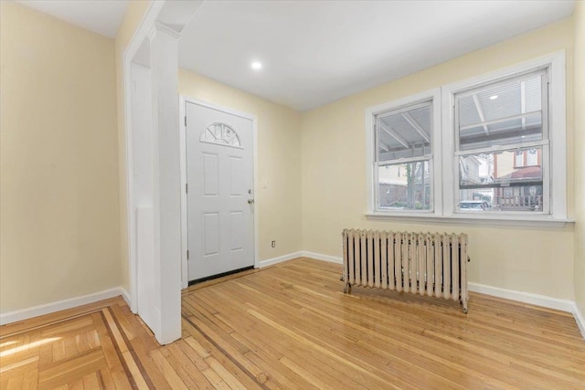 4216 Wickham Ave, Bronx, NY 10466 - entrance foyer featuring radiator heating unit, light wood finished floors, and recessed lighting