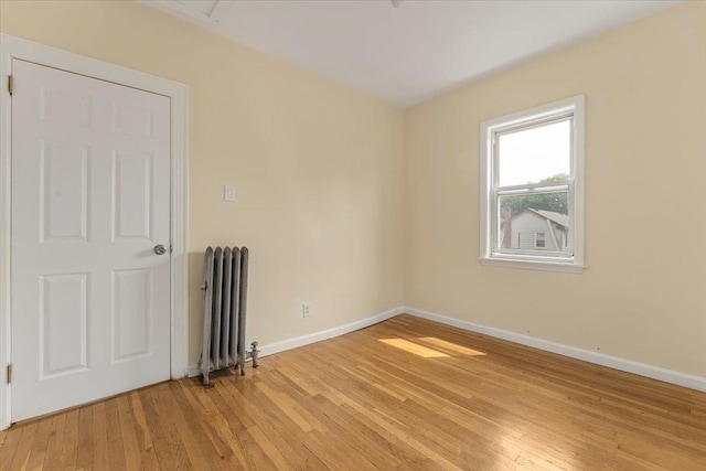 4216 Wickham Ave, Bronx, NY 10466 - empty room with radiator heating unit and light wood-type flooring