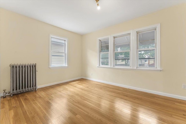 4216 Wickham Ave, Bronx, NY 10466 - empty room with radiator heating unit and light wood-style flooring