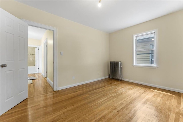 4216 Wickham Ave, Bronx, NY 10466 - unfurnished room featuring radiator heating unit and light wood finished floors