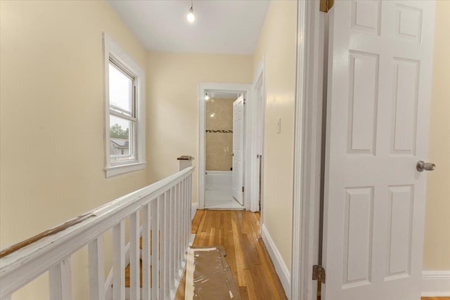 4216 Wickham Ave, Bronx, NY 10466 - corridor featuring light wood-style floors and an upstairs landing