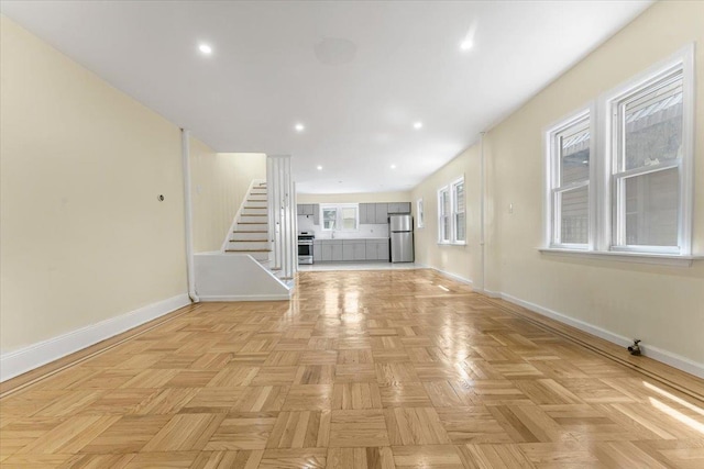4216 Wickham Ave, Bronx, NY 10466 - unfurnished living room with stairs and recessed lighting