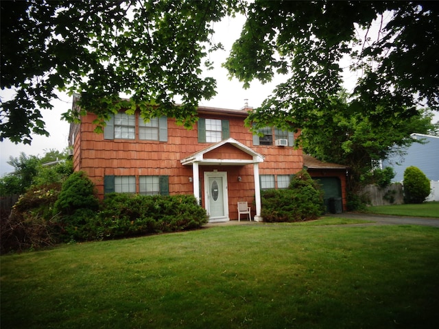 113 Camille Ln, East Patchogue, NY 11772 - view of front of property with a front lawn, a garage, and asphalt driveway