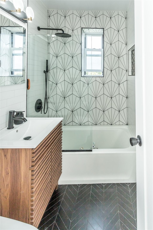 30-47 Hobart St Unit 6, Woodside, NY 11377 - bathroom featuring tile walls, vanity, shower / tub combination, and tile patterned floors