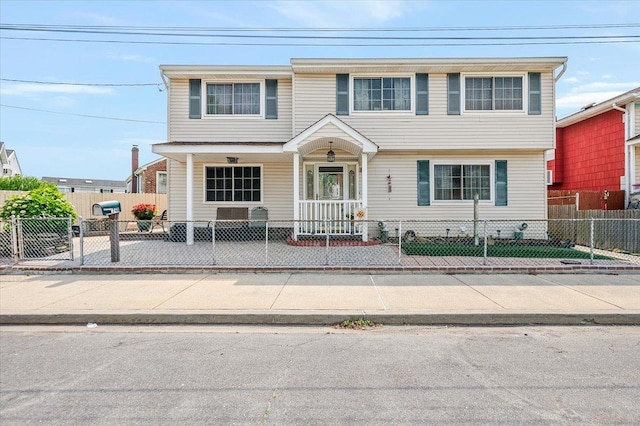 748 Knoll St, Lindenhurst, NY 11757 - view of front of house with covered porch and a fenced front yard