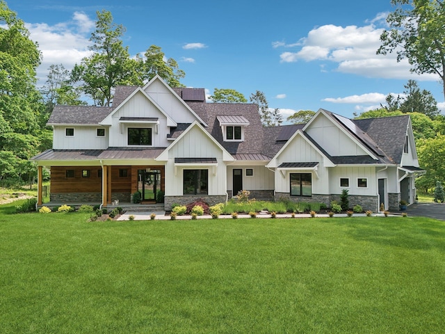 317 Old Mill Rd, Nissequogue, NY 11780 - modern inspired farmhouse featuring a standing seam roof, roof with shingles, and a front yard