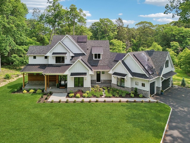 317 Old Mill Rd, Nissequogue, NY 11780 - modern inspired farmhouse with covered porch, a standing seam roof, asphalt driveway, roof with shingles, and board and batten siding