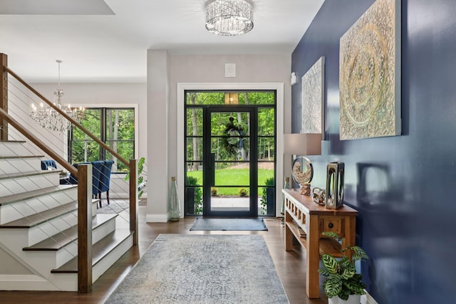 317 Old Mill Rd, Nissequogue, NY 11780 - entrance foyer featuring a chandelier, stairway, and wood finished floors