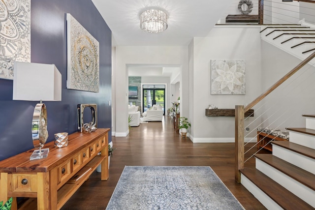 317 Old Mill Rd, Nissequogue, NY 11780 - foyer featuring stairway, wood finished floors, and a chandelier