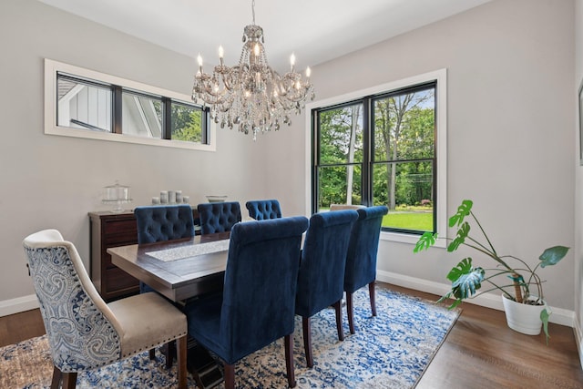 317 Old Mill Rd, Nissequogue, NY 11780 - dining space featuring a chandelier, plenty of natural light, and wood finished floors