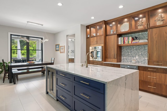 317 Old Mill Rd, Nissequogue, NY 11780 - kitchen featuring backsplash, stainless steel oven, light stone counters, a center island with sink, and recessed lighting