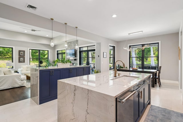 317 Old Mill Rd, Nissequogue, NY 11780 - kitchen with a large island, open floor plan, blue cabinetry, healthy amount of natural light, and recessed lighting