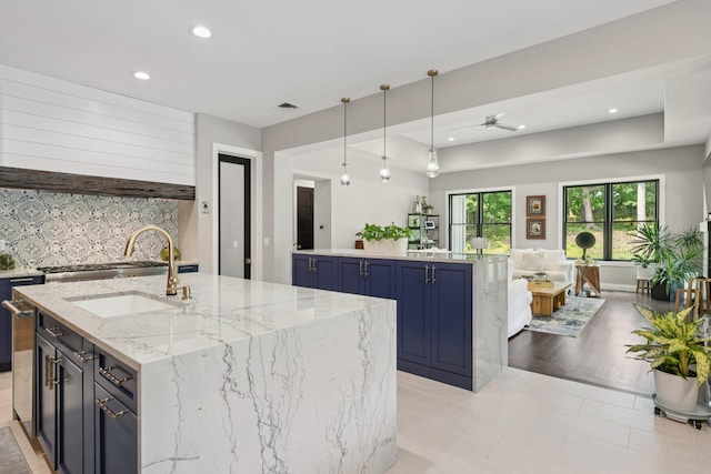 317 Old Mill Rd, Nissequogue, NY 11780 - kitchen featuring a kitchen island with sink, recessed lighting, blue cabinets, decorative light fixtures, and a ceiling fan
