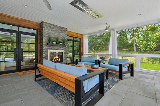 317 Old Mill Rd, Nissequogue, NY 11780 - sunroom / solarium featuring french doors, an outdoor living space with a fireplace, and ceiling fan
