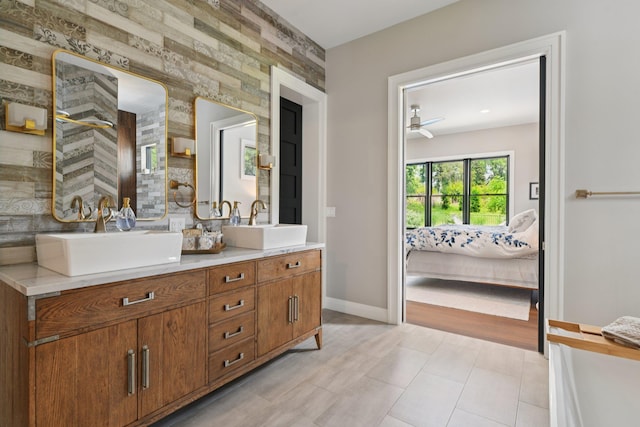 317 Old Mill Rd, Nissequogue, NY 11780 - ensuite bathroom with double vanity, ceiling fan, and an accent wall