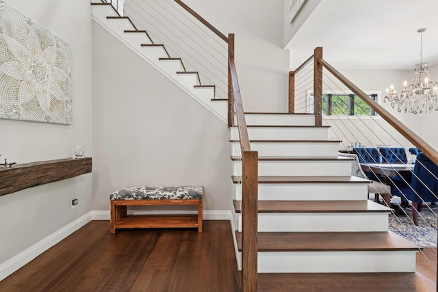 317 Old Mill Rd, Nissequogue, NY 11780 - stairs featuring wood finished floors and a chandelier