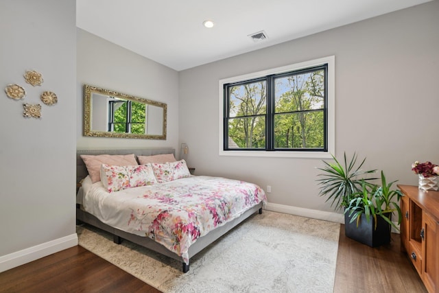 317 Old Mill Rd, Nissequogue, NY 11780 - bedroom featuring multiple windows, wood finished floors, and recessed lighting
