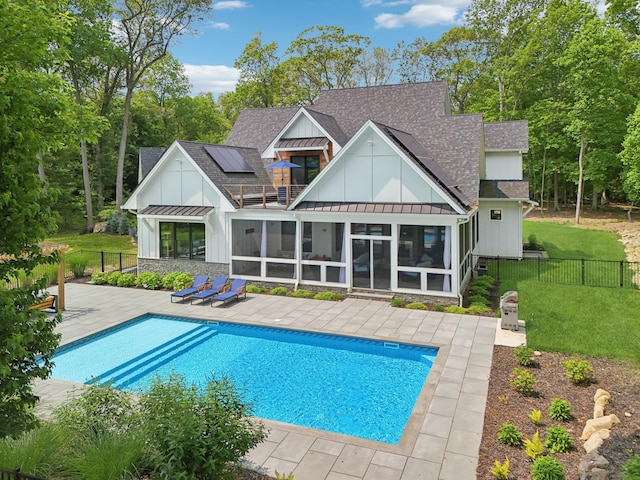 317 Old Mill Rd, Nissequogue, NY 11780 - back of house featuring board and batten siding, a standing seam roof, roof with shingles, and a sunroom