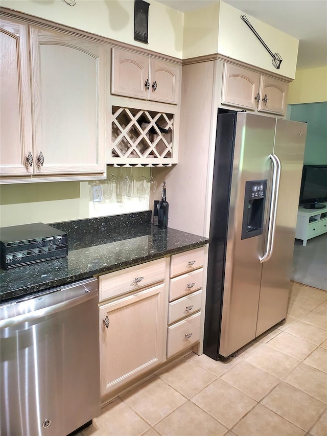 1106 Parkview Dr, Southfields, NY 10975 - kitchen featuring appliances with stainless steel finishes, light tile patterned floors, and dark stone countertops
