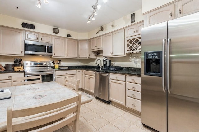 1106 Parkview Dr, Southfields, NY 10975 - kitchen featuring stainless steel appliances, light tile patterned floors, track lighting, and light brown cabinetry