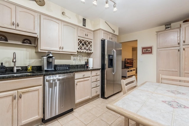 1106 Parkview Dr, Southfields, NY 10975 - kitchen featuring appliances with stainless steel finishes, light tile patterned flooring, dark stone countertops, open shelves, and light brown cabinetry