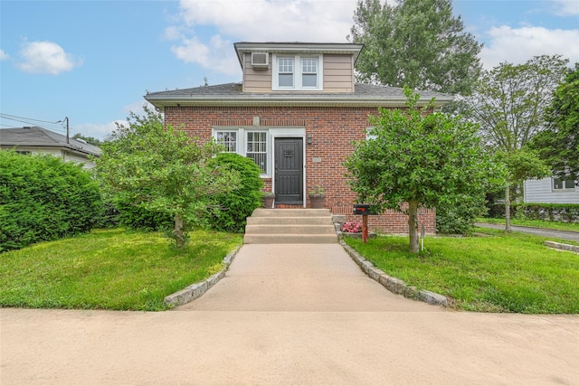 129 Guenther Ave, Valley Stream, NY 11580 - bungalow with brick siding and a front lawn
