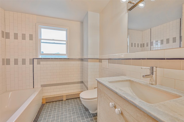 129 Guenther Ave, Valley Stream, NY 11580 - bathroom featuring tile walls, tile patterned floors, vanity, and a wainscoted wall