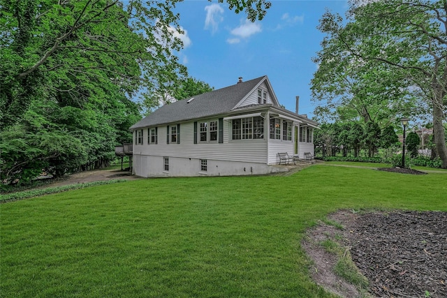 56 Locust Dr, Rocky Point, NY 11778 - back of house with a yard, a chimney, and a shingled roof
