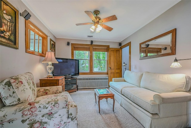 56 Locust Dr, Rocky Point, NY 11778 - living room with radiator, carpet, ceiling fan, and ornamental molding