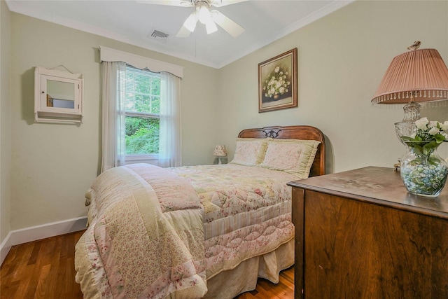 56 Locust Dr, Rocky Point, NY 11778 - bedroom featuring crown molding, wood finished floors, and a ceiling fan