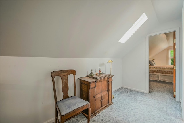 56 Locust Dr, Rocky Point, NY 11778 - living area featuring a skylight, vaulted ceiling, and light carpet