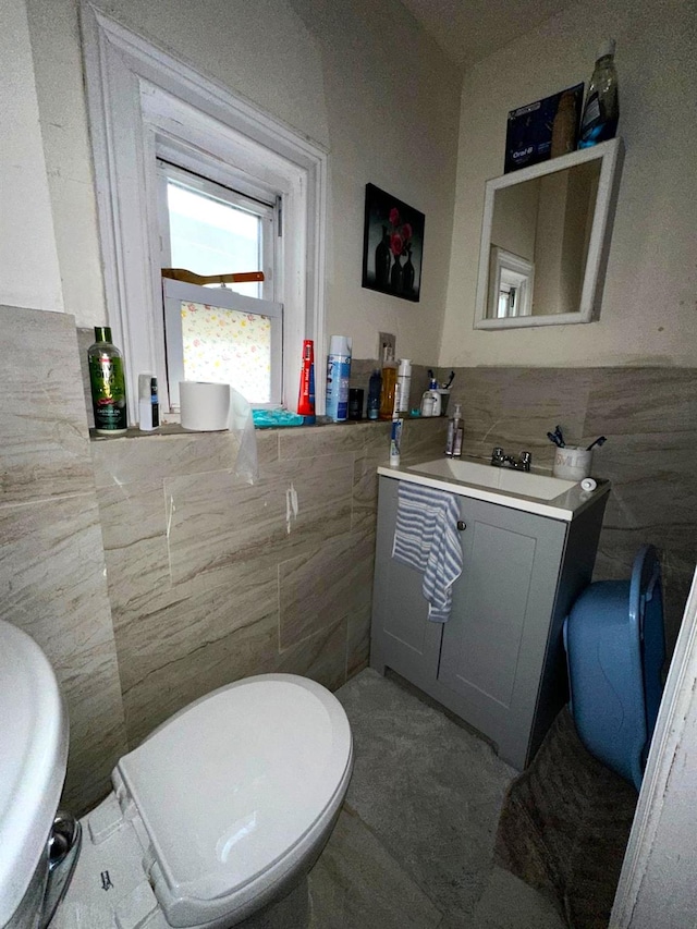 110 Beech St, Yonkers, NY 10701 - bathroom featuring tile walls, vanity, and a wainscoted wall