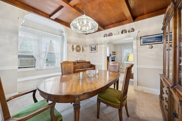 45 Crosby Ave, Albertson, NY 11507 - dining room featuring a chandelier, coffered ceiling, beam ceiling, and light carpet