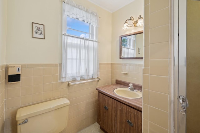 45 Crosby Ave, Albertson, NY 11507 - bathroom featuring tile walls, vanity, and wainscoting