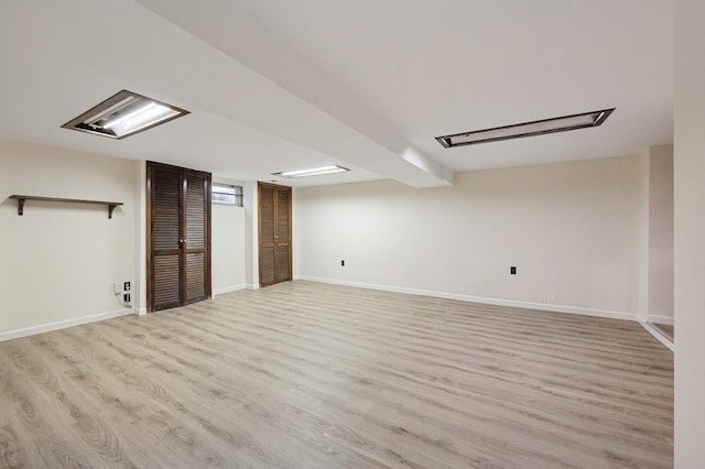 45 Crosby Ave, Albertson, NY 11507 - finished basement with light wood-style floors and baseboards