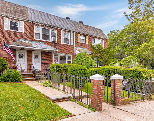 200-06 39th Ave, Bayside, NY 11361 - view of front facade featuring a fenced front yard, a shingled roof, a gate, and cooling unit