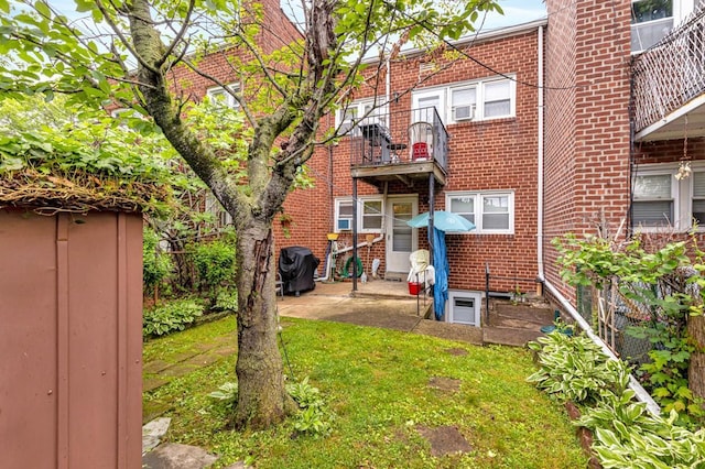 200-06 39th Ave, Bayside, NY 11361 - rear view of property featuring brick siding and a lawn
