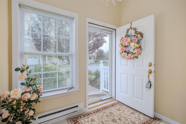 164 Ira Rd, Mount Sinai, NY 11766 - foyer featuring baseboard heating and a chandelier