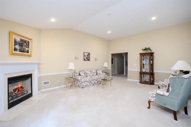 164 Ira Rd, Mount Sinai, NY 11766 - living area featuring vaulted ceiling, carpet flooring, a fireplace with flush hearth, and recessed lighting