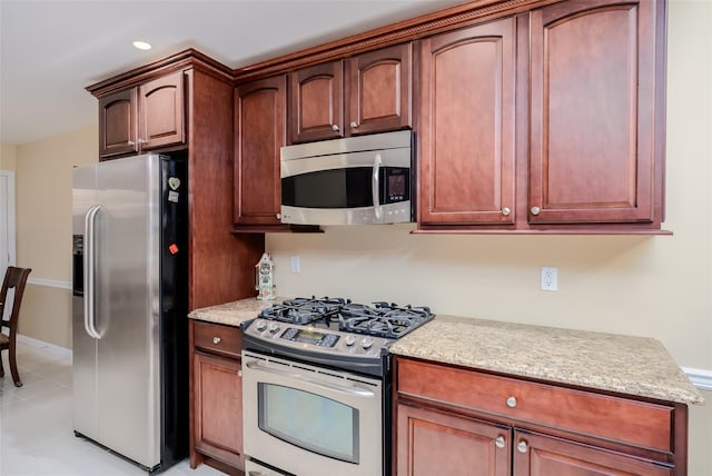 164 Ira Rd, Mount Sinai, NY 11766 - kitchen with stainless steel appliances, light tile patterned floors, recessed lighting, and light stone countertops