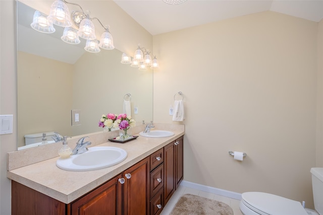 164 Ira Rd, Mount Sinai, NY 11766 - bathroom featuring tile patterned floors, double vanity, and vaulted ceiling