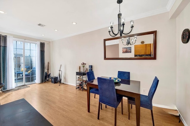 109 Neptune Ln Unit 5, Bronx, NY 10473 - dining area with a chandelier, wood finished floors, ornamental molding, and recessed lighting