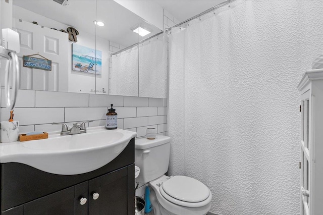 7 Pine Tree Dr, Shirley, NY 11967 - bathroom featuring vanity, decorative backsplash, tile walls, and a textured wall