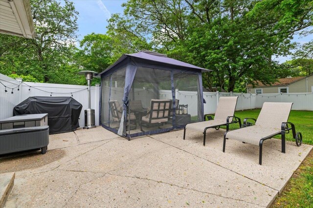 7 Pine Tree Dr, Shirley, NY 11967 - fenced backyard with a patio area, a gazebo, and area for grilling