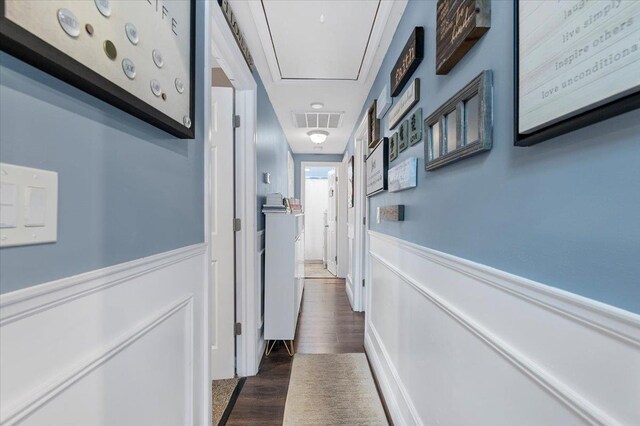 7 Pine Tree Dr, Shirley, NY 11967 - hallway with a wainscoted wall, dark wood-style flooring, and attic access
