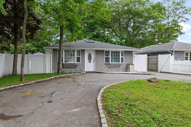 7 Pine Tree Dr, Shirley, NY 11967 - ranch-style house featuring a gate, asphalt driveway, and roof with shingles