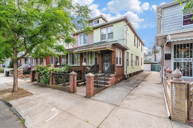 342 E 55th St, Brooklyn, NY 11203 - view of front of home with an outdoor structure and a detached garage