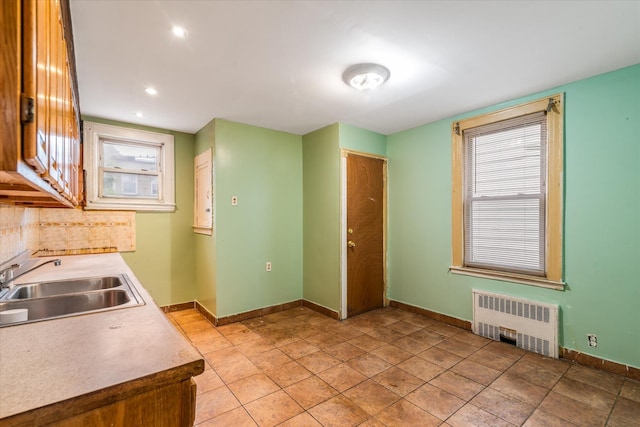342 E 55th St, Brooklyn, NY 11203 - kitchen featuring radiator heating unit, tasteful backsplash, healthy amount of natural light, light countertops, and recessed lighting
