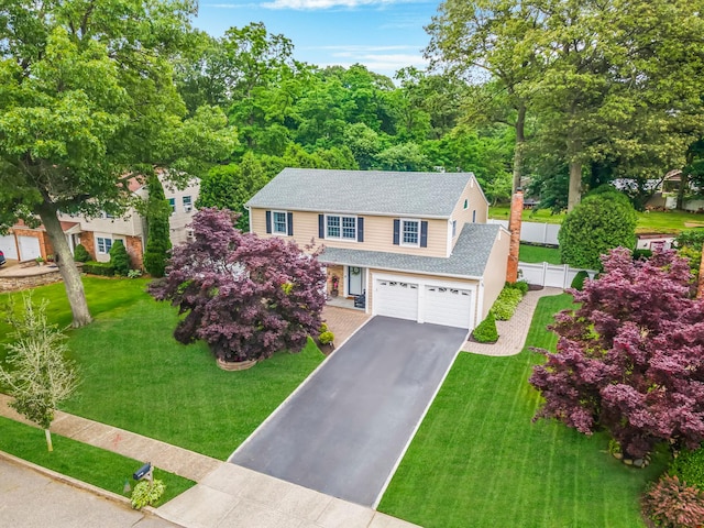 15 Format Ln, Smithtown, NY 11787 - view of front of house with asphalt driveway, a shingled roof, a garage, and a chimney