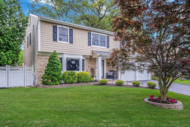 15 Format Ln, Smithtown, NY 11787 - colonial-style house featuring stone siding, driveway, and an attached garage